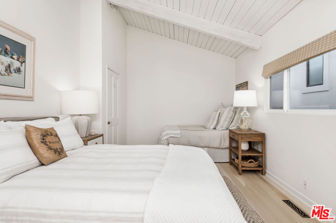 31640 Sea Level Drive Malibu, CA 90265 - Photo 28 of 41 a bedroom with a bed and a couch