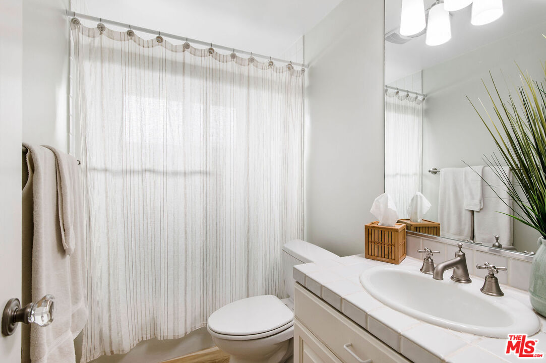 31640 Sea Level Drive Malibu, CA 90265 - Photo 29 of 41 a bathroom with a sink a toilet and shower