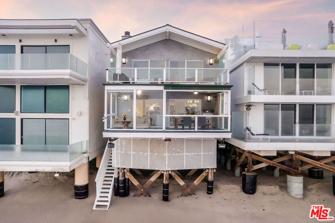 31640 Sea Level Drive Malibu, CA 90265 - Photo 33 of 41 a front view of a building with a large window and sitting space