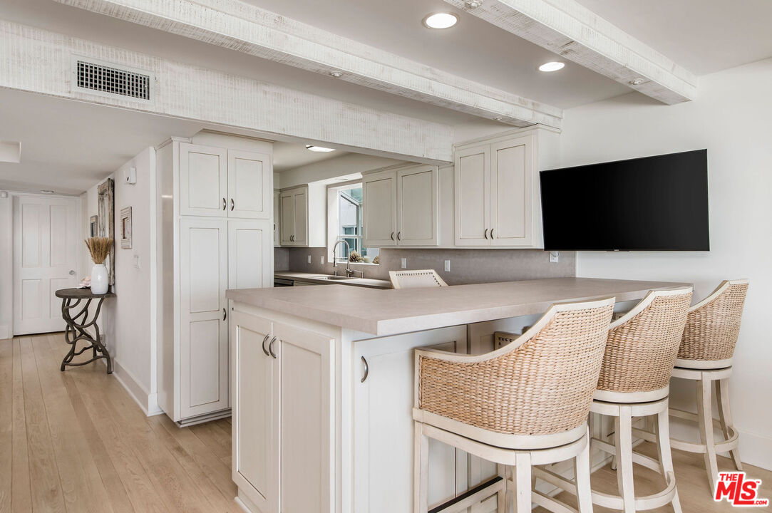 31640 Sea Level Drive Malibu, CA 90265 - Photo 5 of 41 a living room with furniture and a flat screen tv