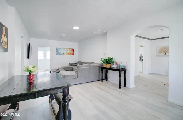 a room with furniture and a wooden floor