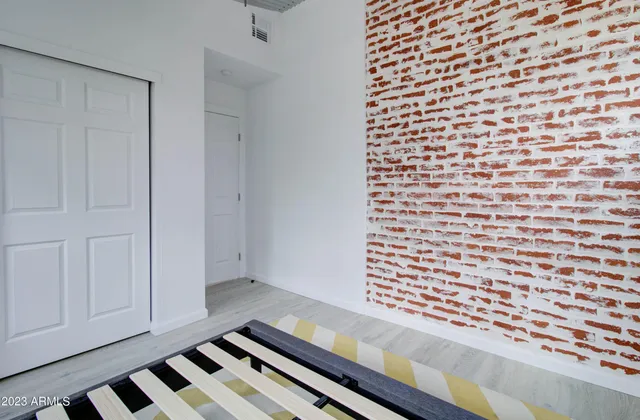 a view of a room with wooden floor