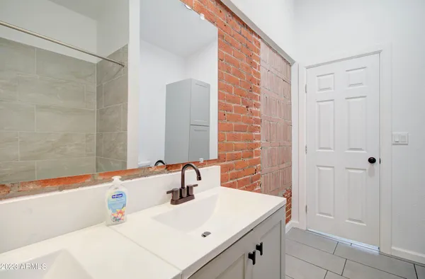 a bathroom with a sink and a mirror