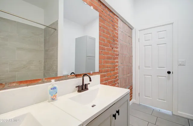 a bathroom with a sink and a mirror