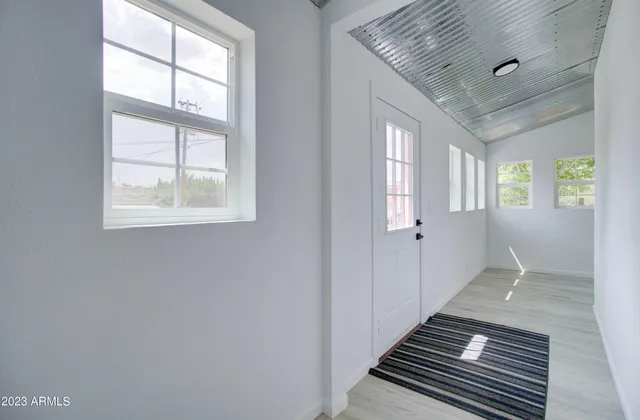 an entryway with a workspace