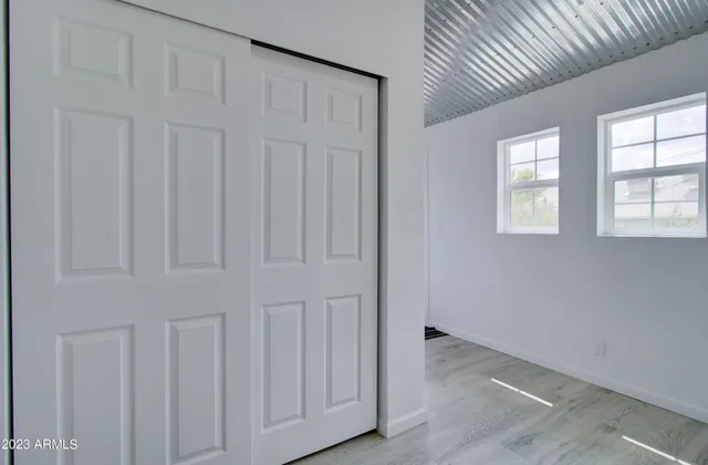 a view of an empty room with a window