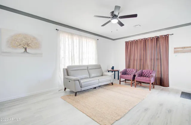 a living room with furniture and a window