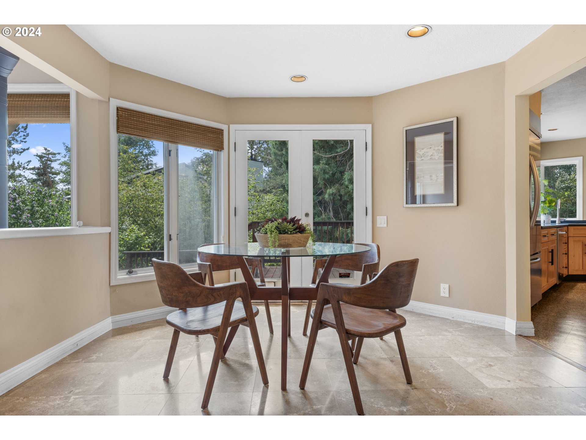 4803 Southwest Stonebrook Court Portland, OR 97239 - Photo 11 of 40 a dining room with furniture and wooden floor