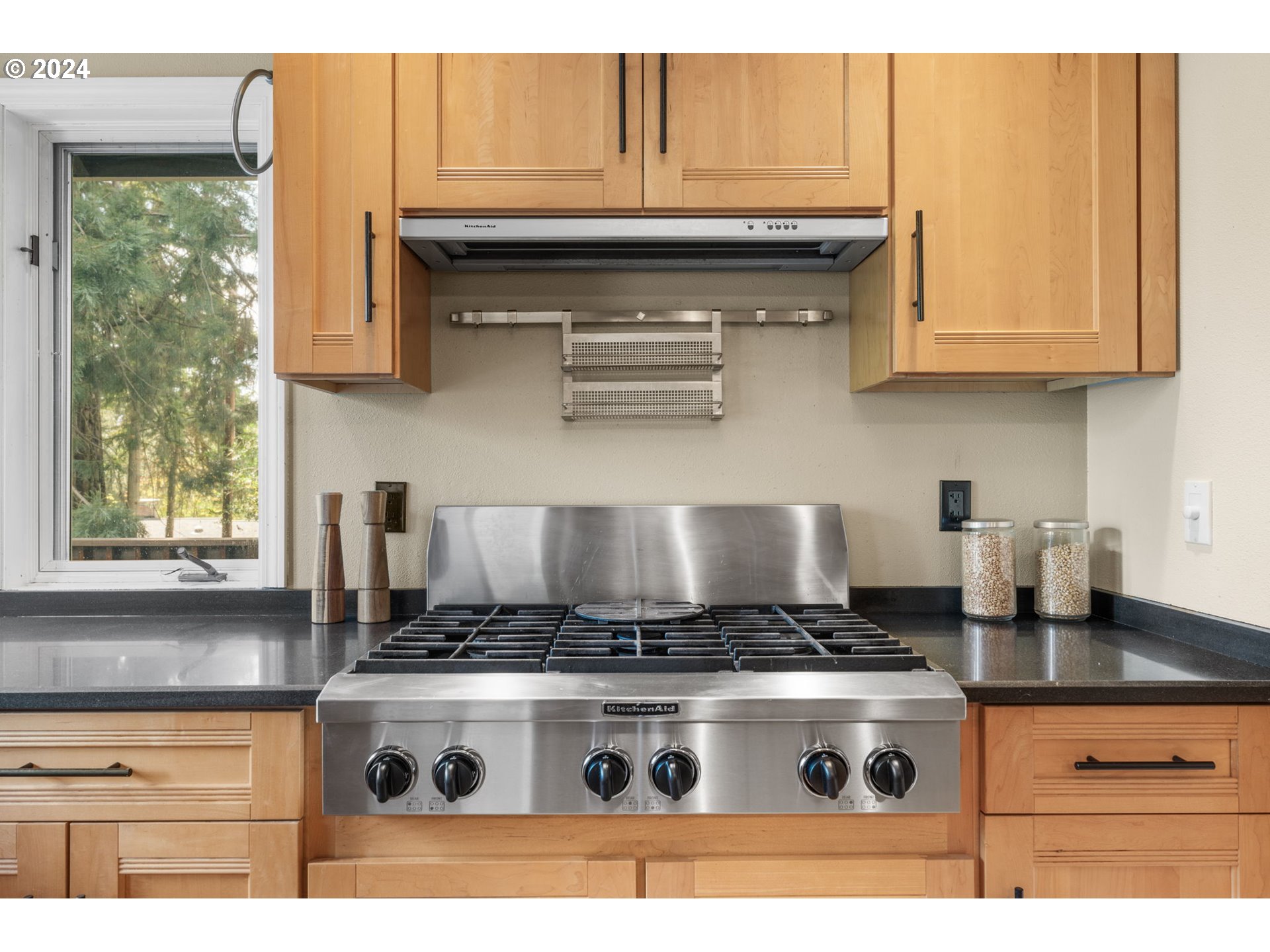 4803 Southwest Stonebrook Court Portland, OR 97239 - Photo 14 of 40 a stove top oven sitting inside of a kitchen