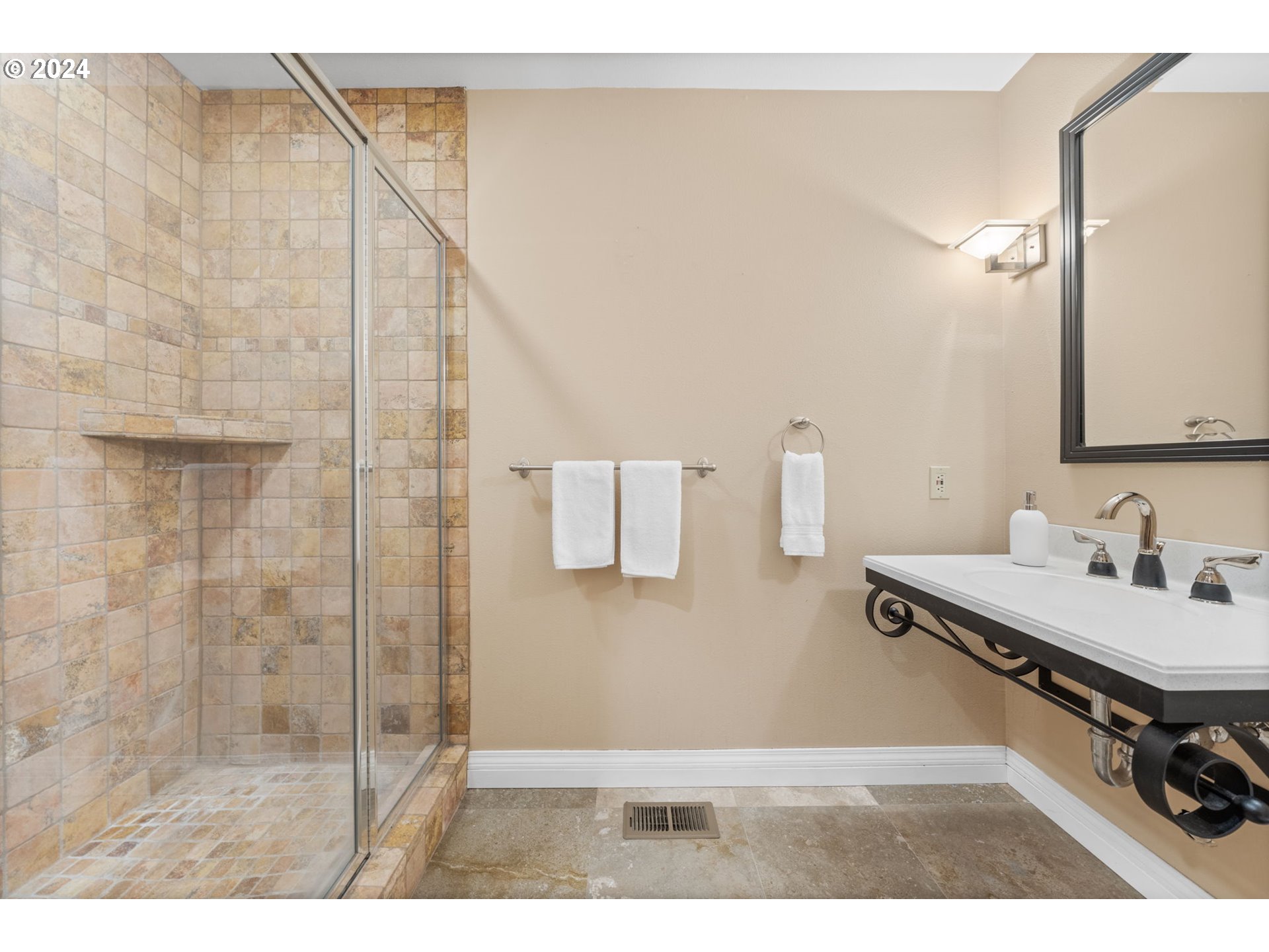 4803 Southwest Stonebrook Court Portland, OR 97239 - Photo 15 of 40 a bathroom with a sink and a mirror