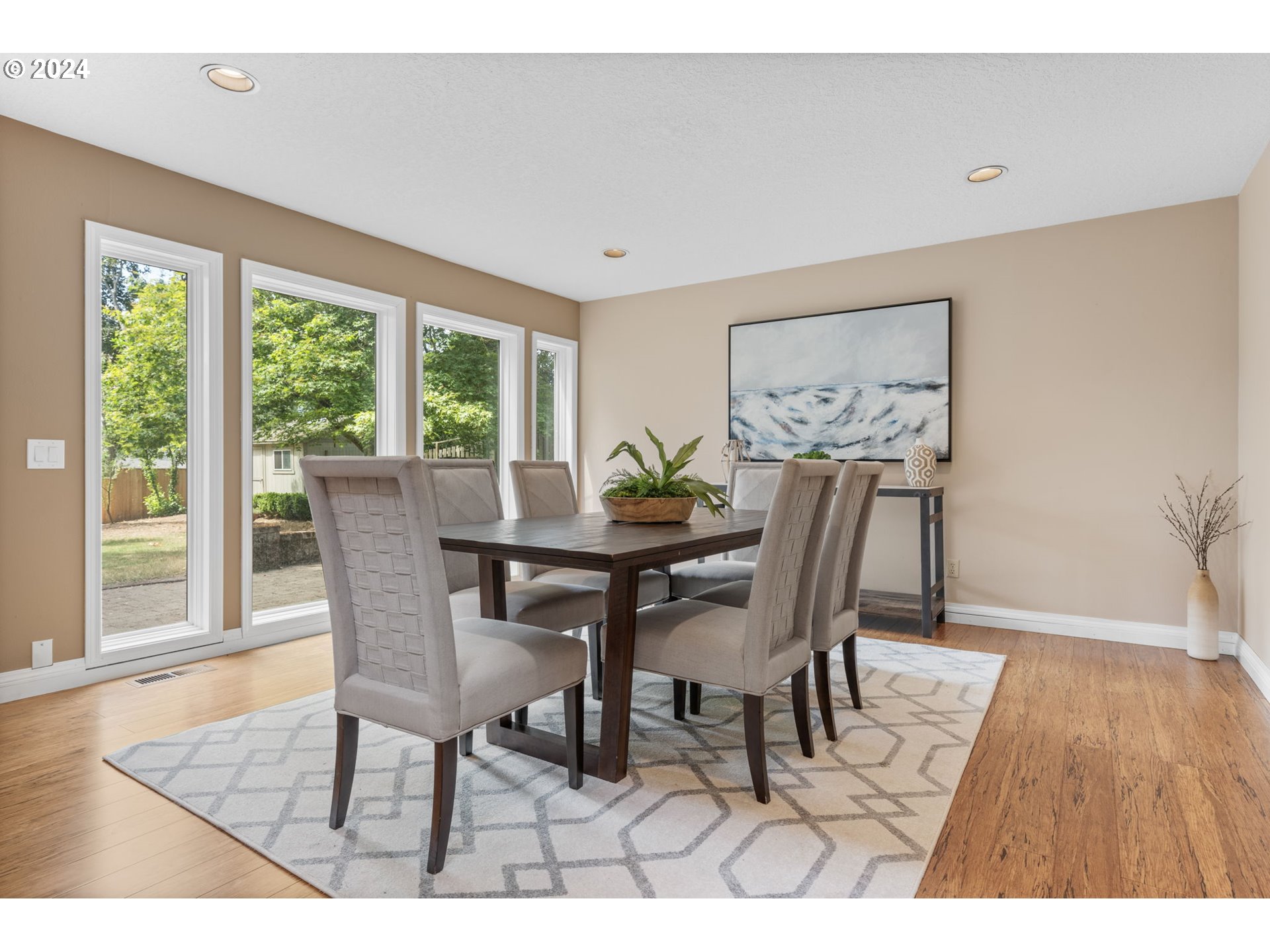4803 Southwest Stonebrook Court Portland, OR 97239 - Photo 17 of 40 a view of a dining room with furniture window and wooden floor