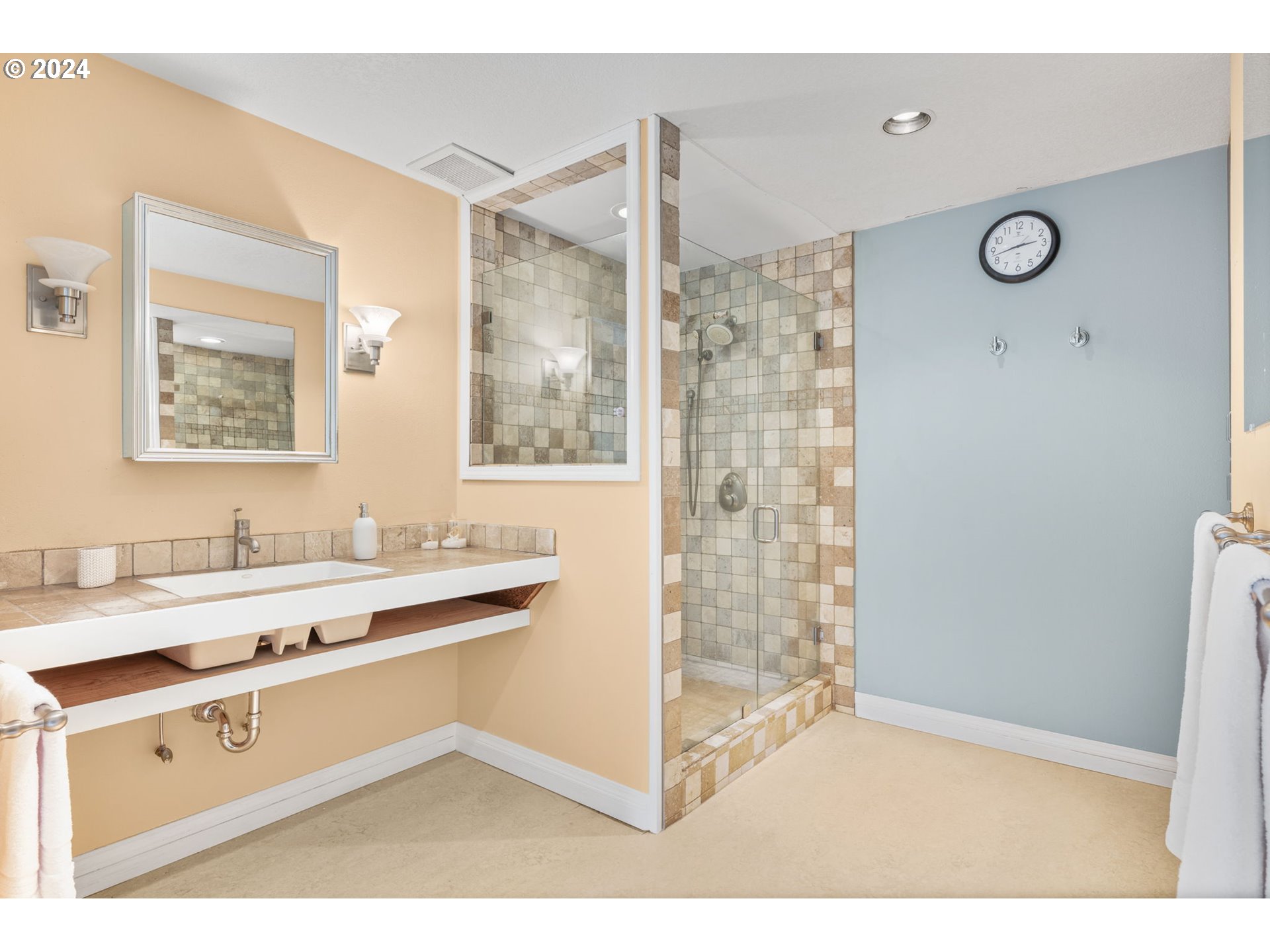 4803 Southwest Stonebrook Court Portland, OR 97239 - Photo 24 of 40 a bathroom with a sink a mirror and a shower