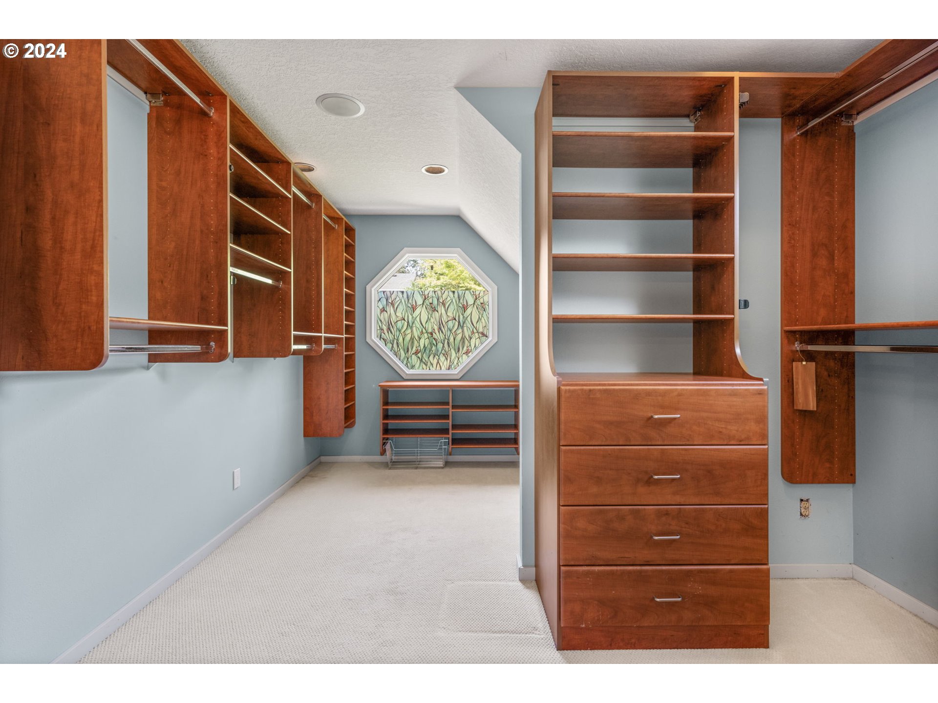 4803 Southwest Stonebrook Court Portland, OR 97239 - Photo 27 of 40 a view of walk in closet with empty racks
