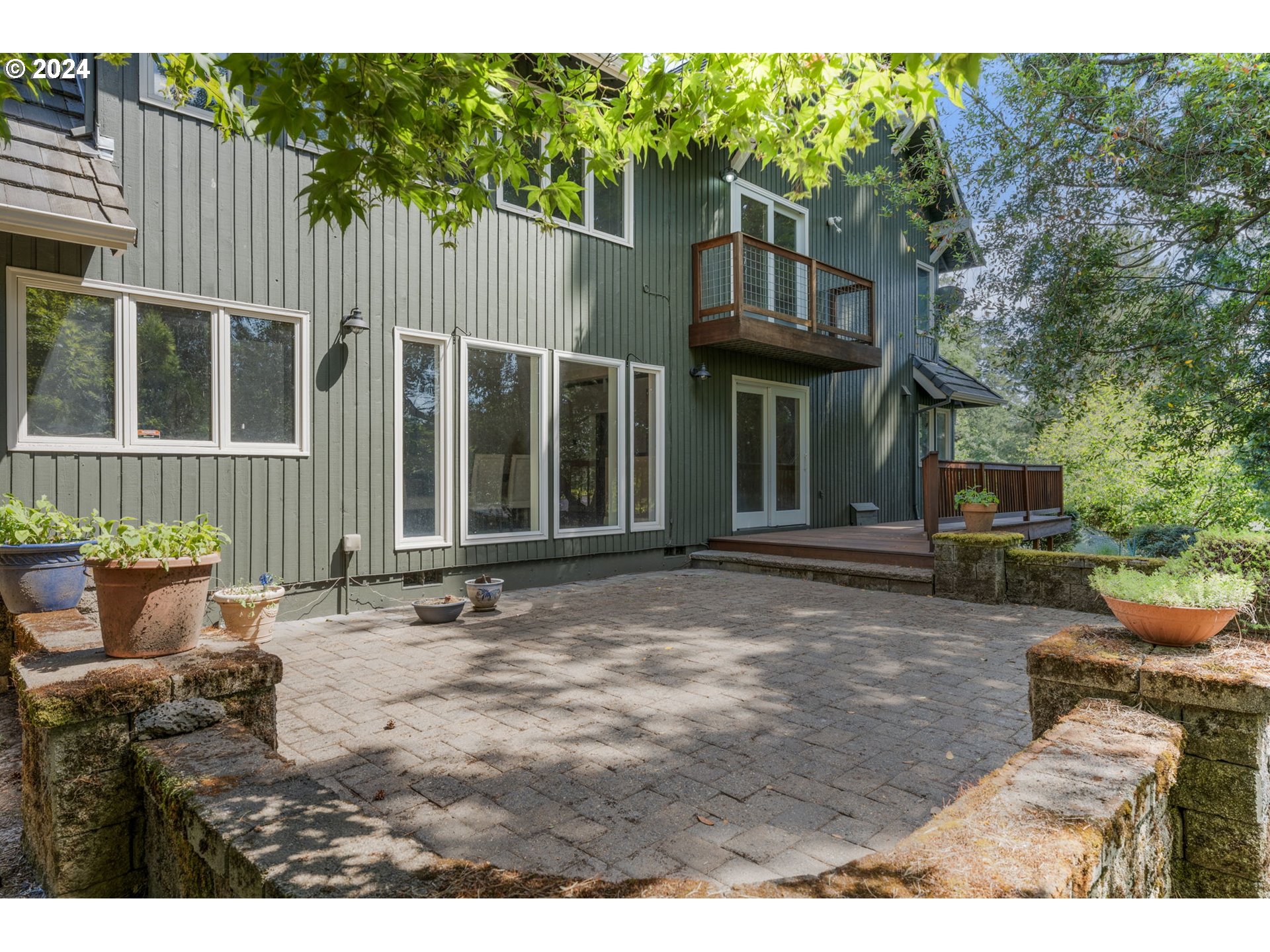 4803 Southwest Stonebrook Court Portland, OR 97239 - Photo 32 of 40 a backyard of a house with seating space