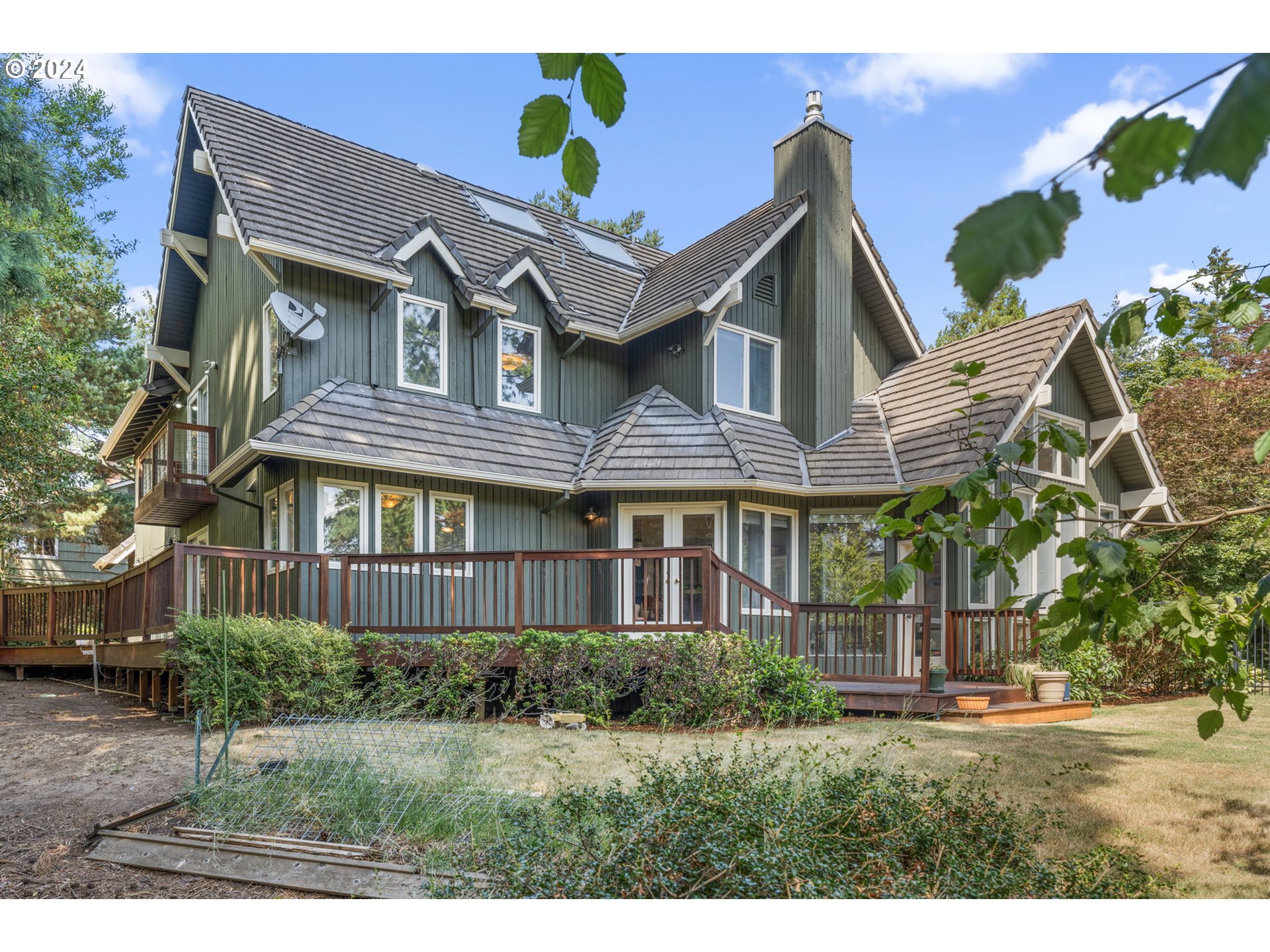 4803 Southwest Stonebrook Court Portland, OR 97239 - Photo 35 of 40 a front view of a house with a garden