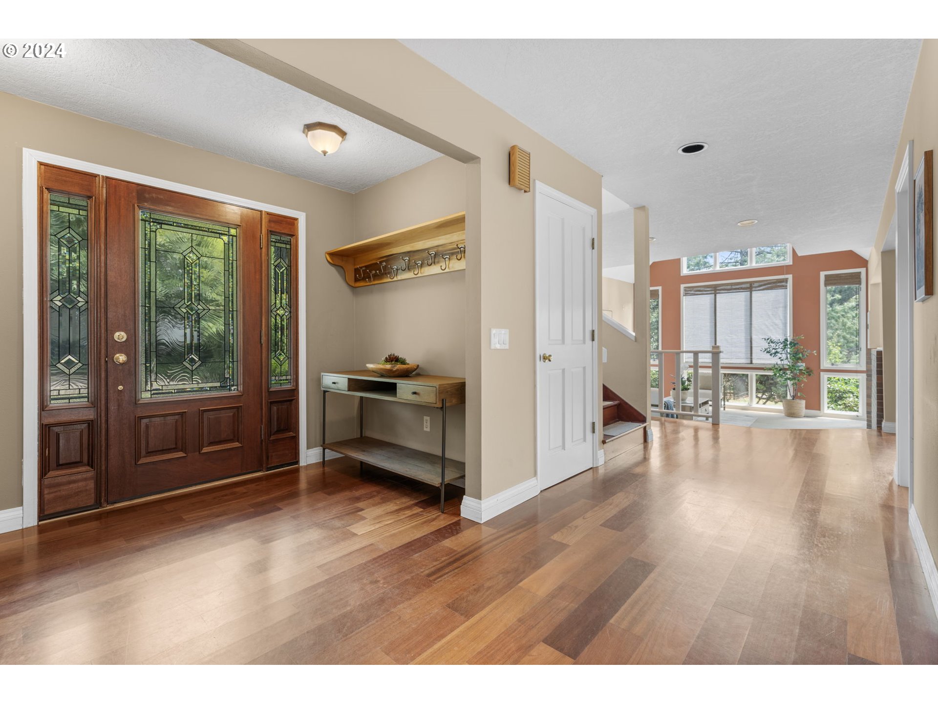 4803 Southwest Stonebrook Court Portland, OR 97239 - Photo 6 of 40 a living room with furniture wooden floor and a large window