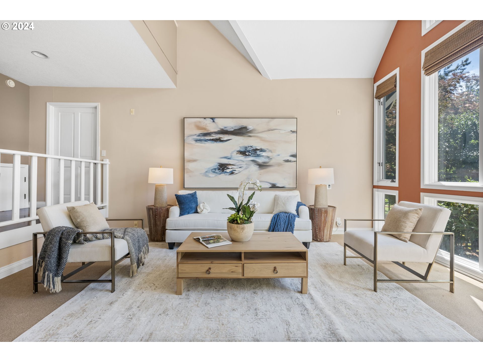 4803 Southwest Stonebrook Court Portland, OR 97239 - Photo 9 of 40 a living room with furniture and a painting on the wall