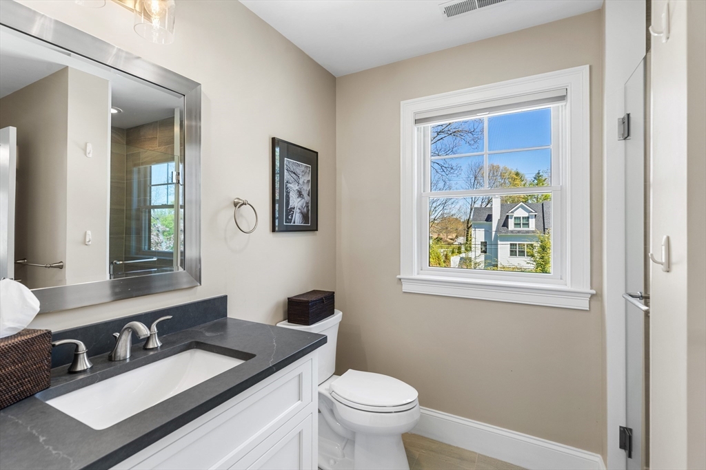 24 Pine Knoll Road Lexington, MA 02420 - Photo 26 of 41 a bathroom with a toilet a sink and mirror