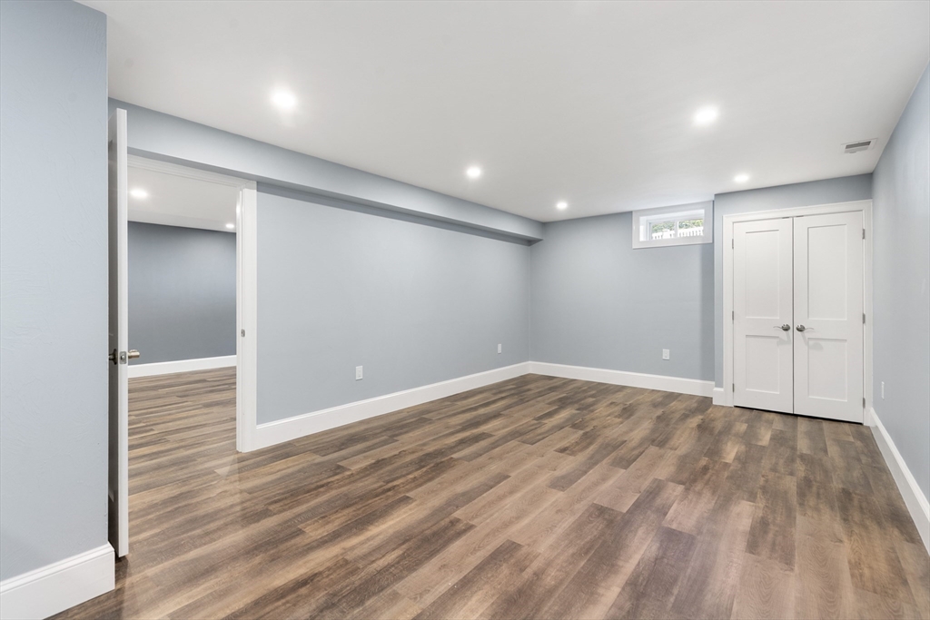 24 Pine Knoll Road Lexington, MA 02420 - Photo 31 of 41 wooden floor in an empty room with wooden floor