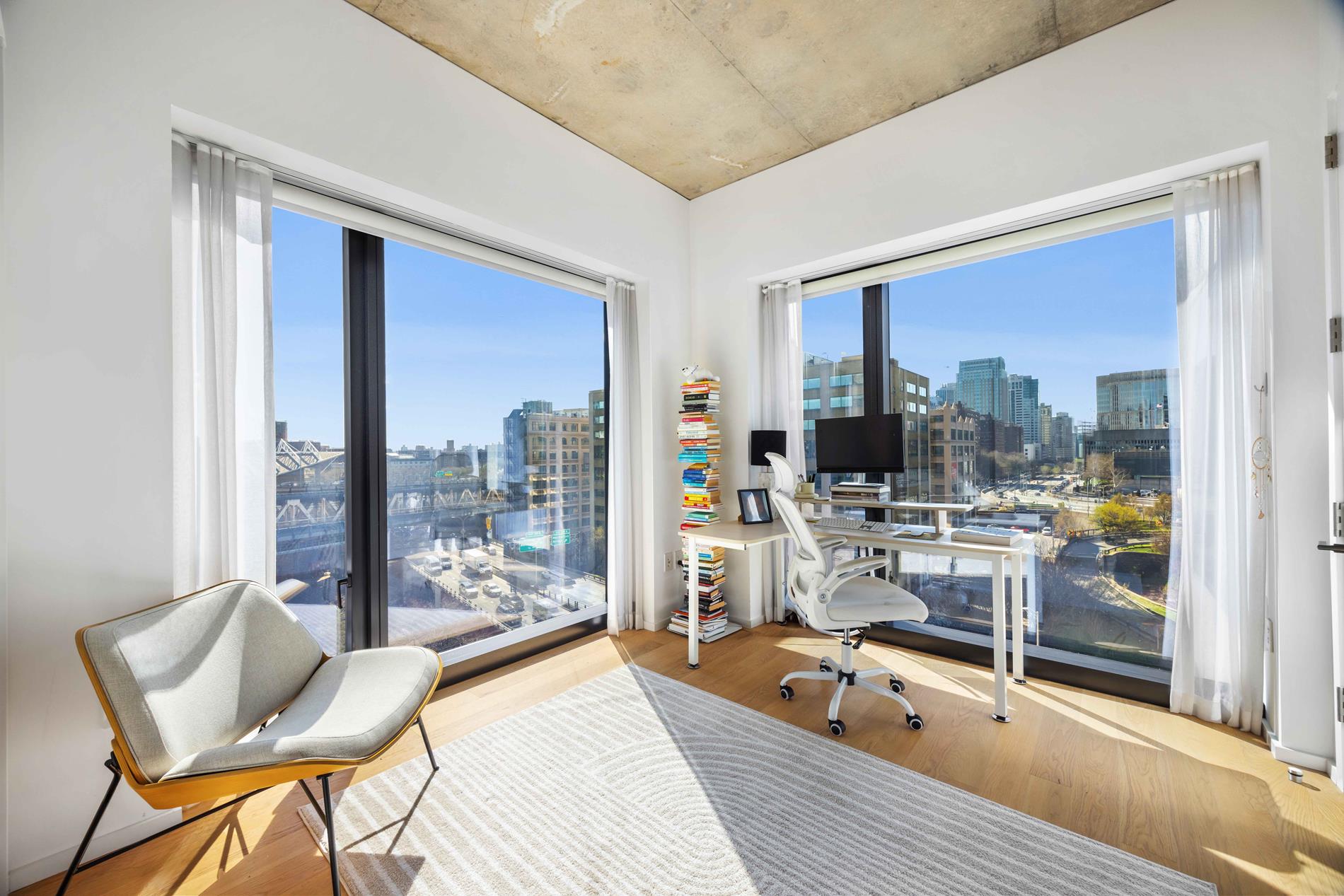 98 Front Street, Unit PH3E Brooklyn, NY 11201 - Photo 9 of 16 a room with patio furniture and a large window