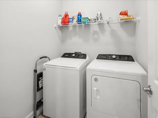 a view of a house with pool and a chairs