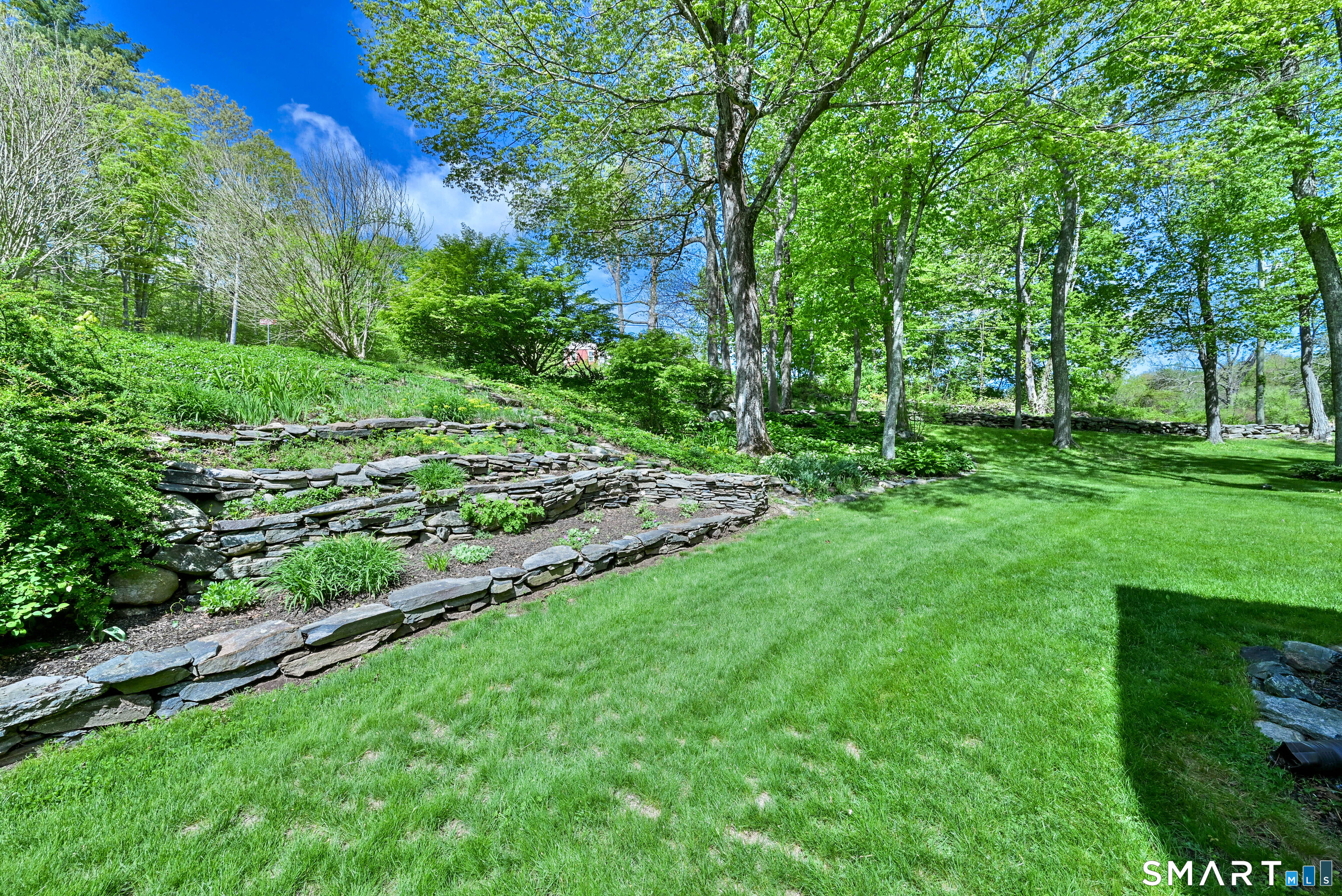 309 O'Leary Road Thompson, CT 06277 - Photo 9 of 40 a view of a yard with a tree