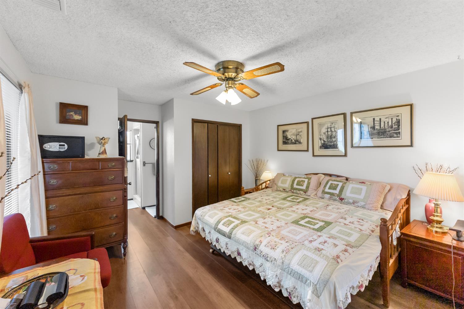 4776 Stetson Road Clovis, CA 93619 - Photo 21 of 49 a bedroom with a bed and wooden floor