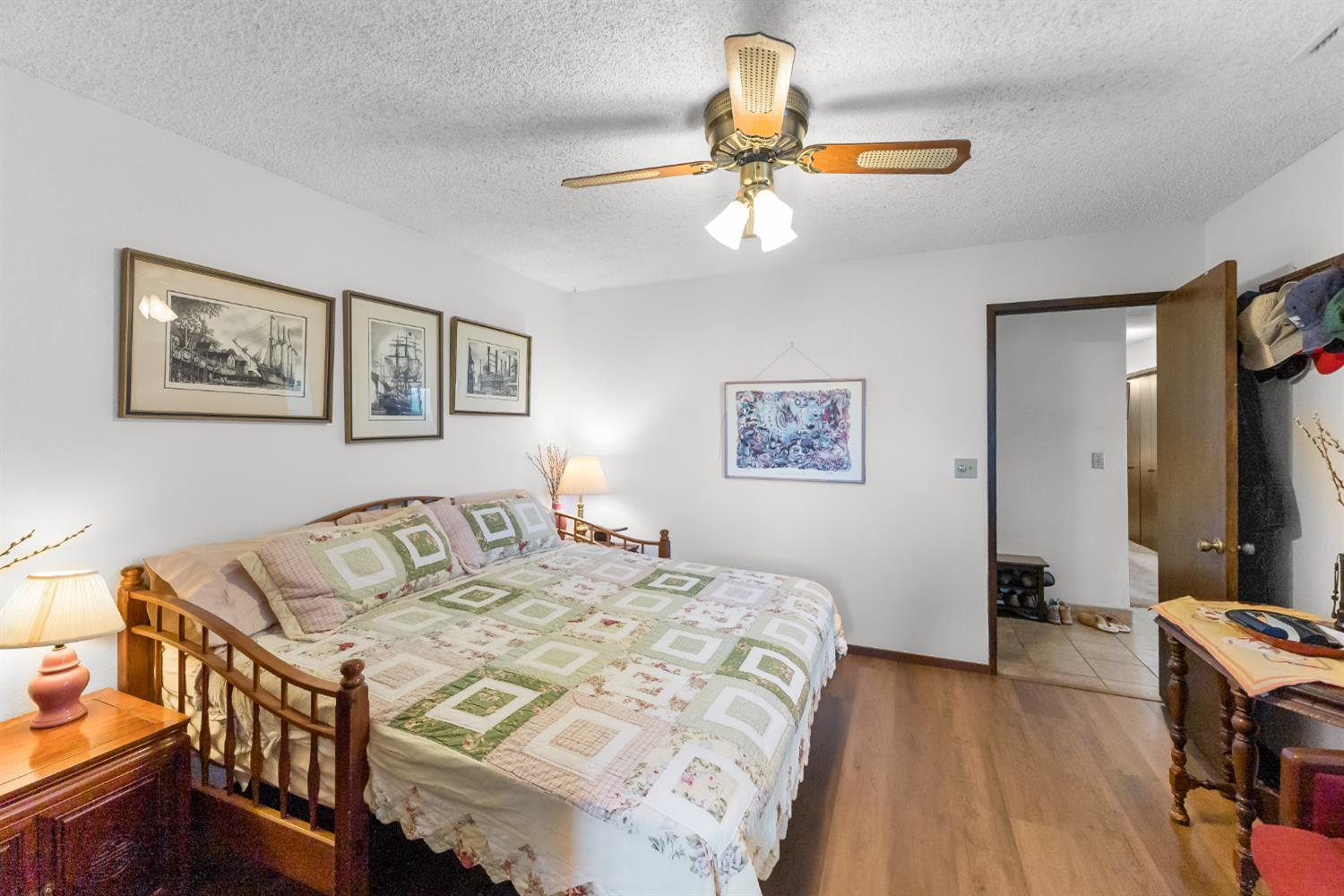 4776 Stetson Road Clovis, CA 93619 - Photo 22 of 49 a bedroom with a bed and a chandelier