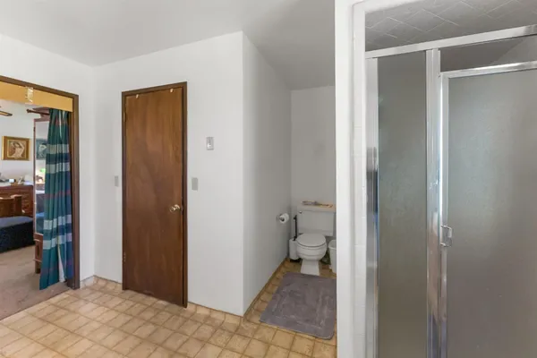 a bathroom with a toilet and a sink