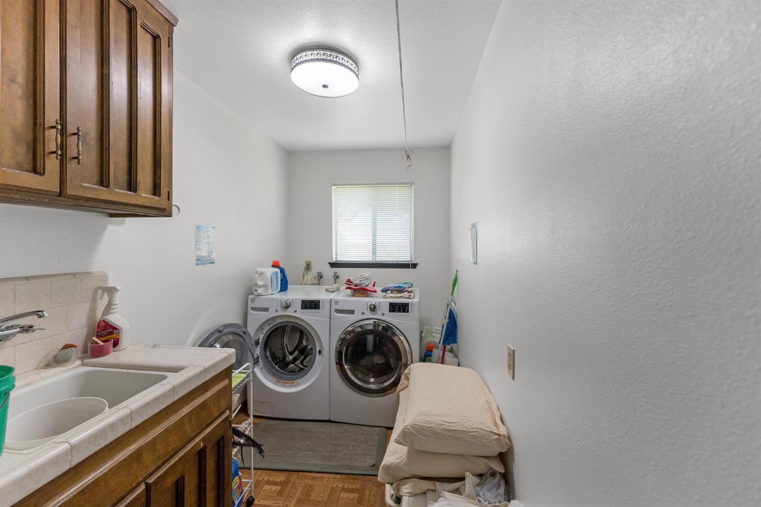 4776 Stetson Road Clovis, CA 93619 - Photo 32 of 49 a utility room with sink dryer and washer