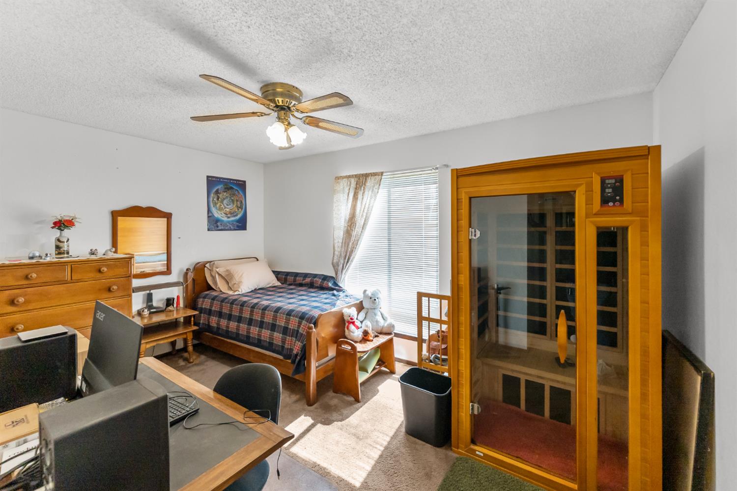 4776 Stetson Road Clovis, CA 93619 - Photo 36 of 49 a bedroom with a bed and a chandelier