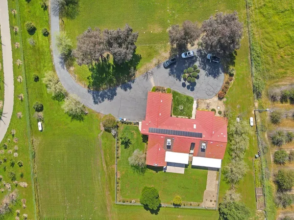 an aerial view of a residential apartment building with a yard