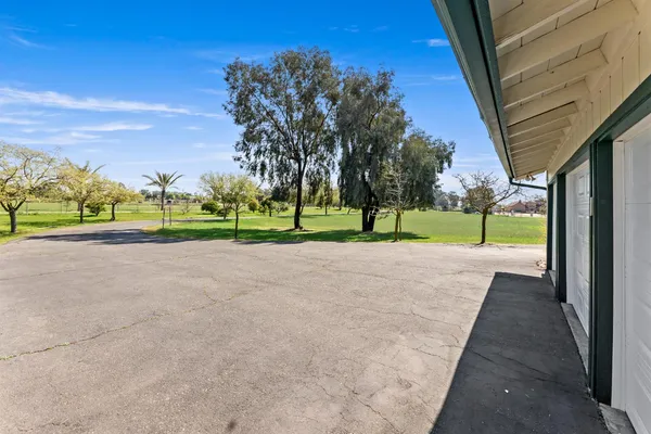 a view of outdoor space with yard and mountain view in back