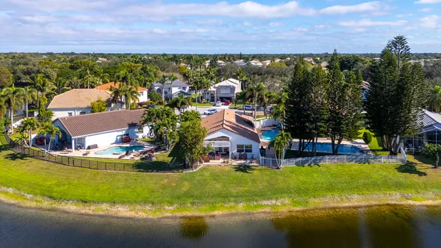 a view of a hallway with wooden floor and entryway