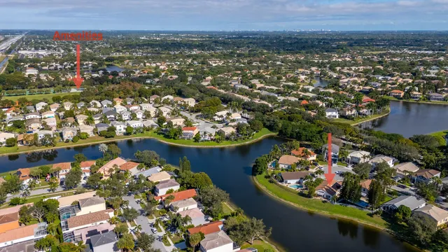 a bedroom with a bed and a flat tv screen on dresser