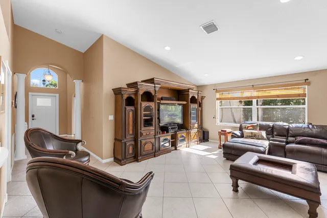 a room with gym equipment and windows