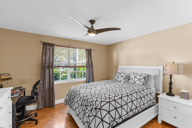 a kitchen with a table chairs and white cabinets