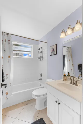 a kitchen with a sink a stove and chairs