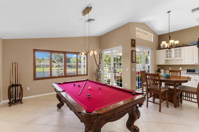 a bedroom with furniture and a wooden floor