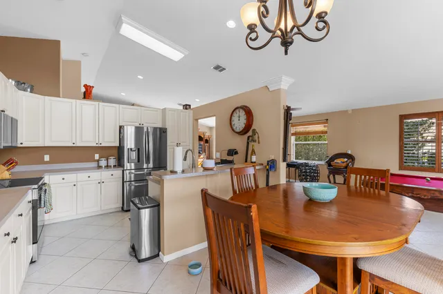a kitchen with a sink cabinets and appliances