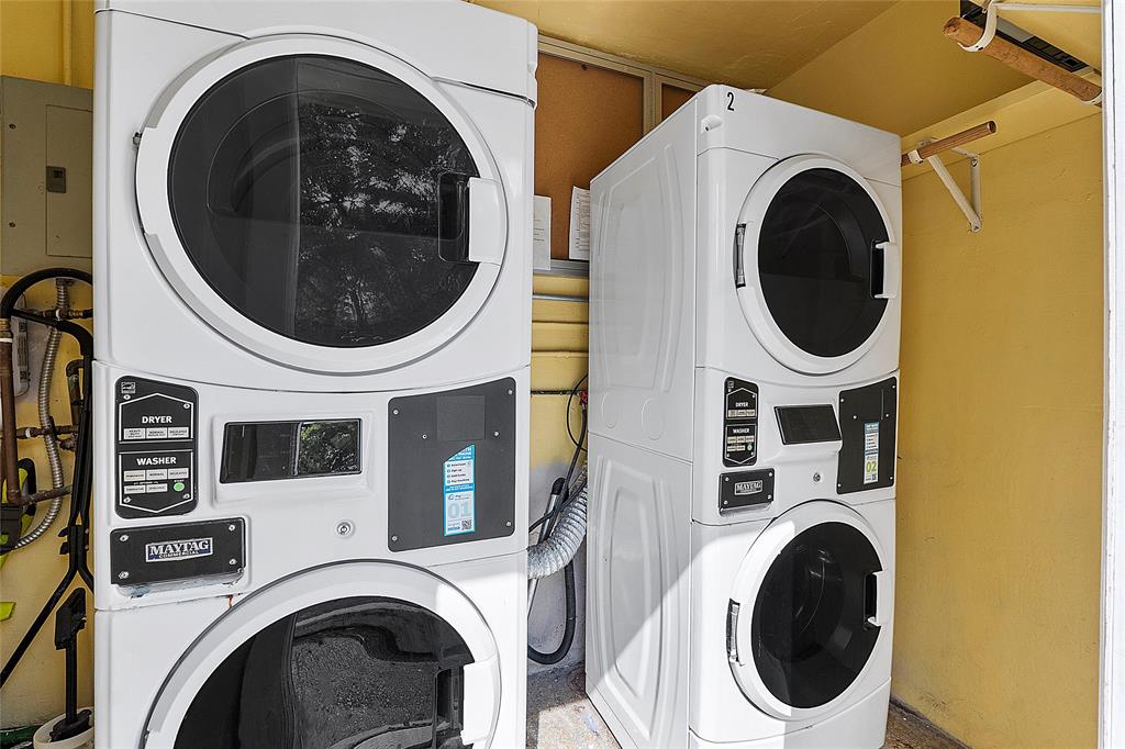 2741 Northeast 8th Avenue, Unit 10 Wilton Manors, FL 33334 - Photo 12 of 28 a close up view of a washer and dryer