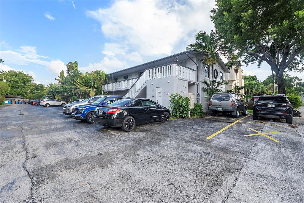 2741 Northeast 8th Avenue, Unit 10 Wilton Manors, FL 33334 - Photo 23 of 28 a view of a car parked in front of a house