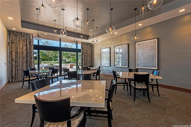 a large dining space with furniture window and outside view