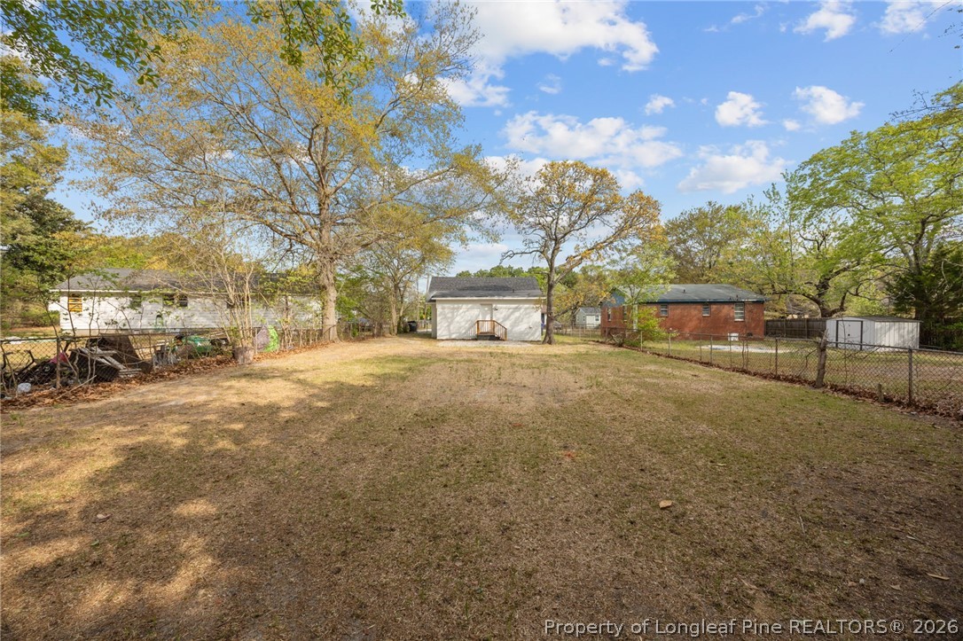 625 Eva Circle Spring Lake, NC 28390 - Photo 26 of 28 a view of yard and basketball court