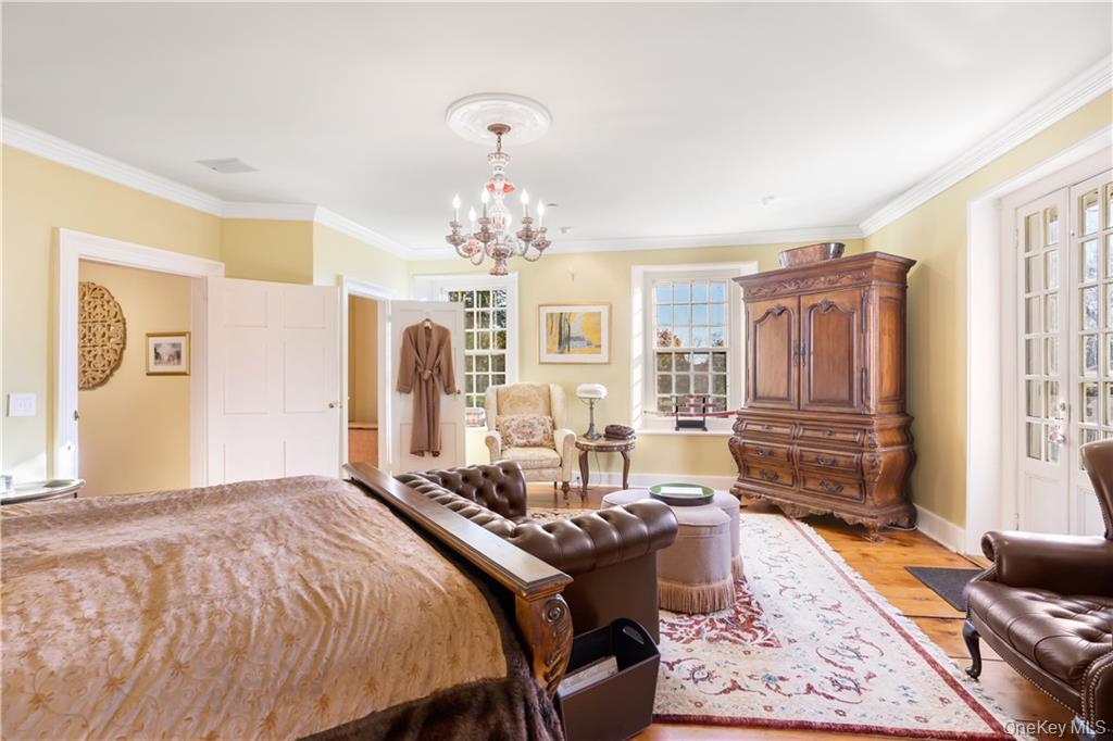 11 Brown Road Pleasant Valley, NY 12569 - Photo 15 of 26 a bed room with a bed and a chandelier
