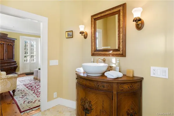 a bathroom with a sink and a mirror