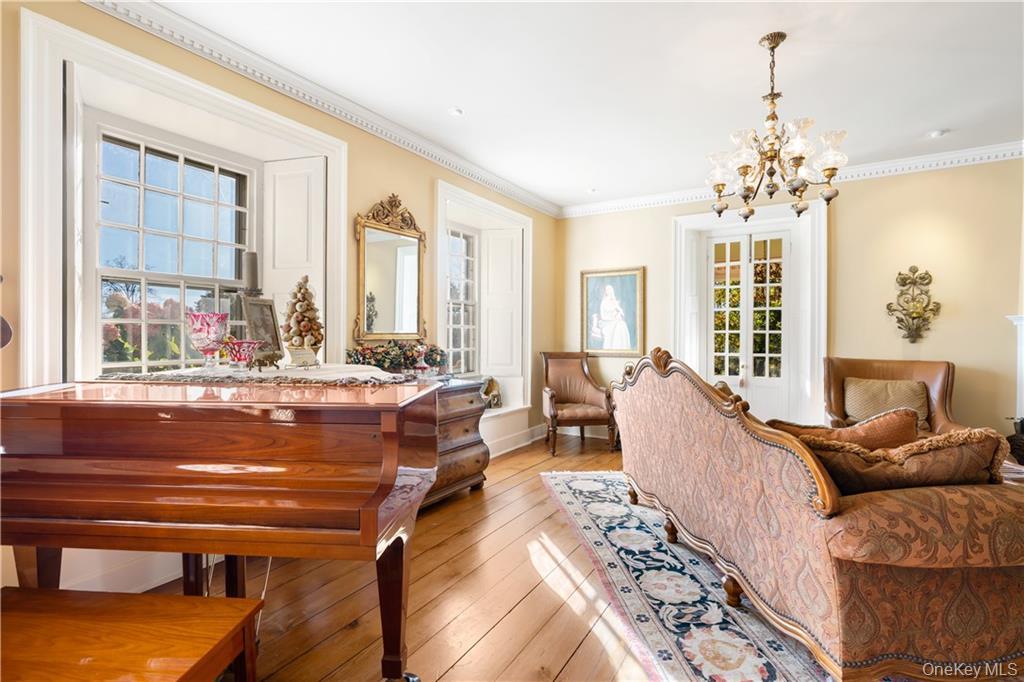11 Brown Road Pleasant Valley, NY 12569 - Photo 7 of 26 a living room with furniture and a chandelier