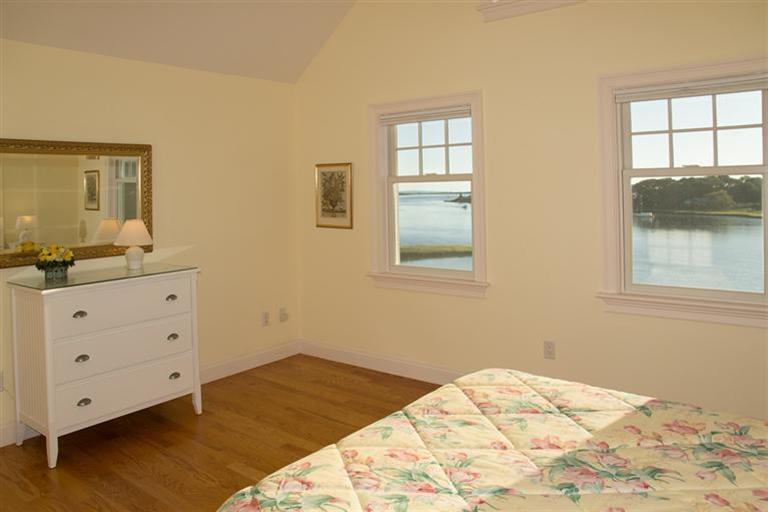 429 Monomoscoy Road Mashpee, MA 02649 - Photo 15 of 26 a bedroom with a bed and a window