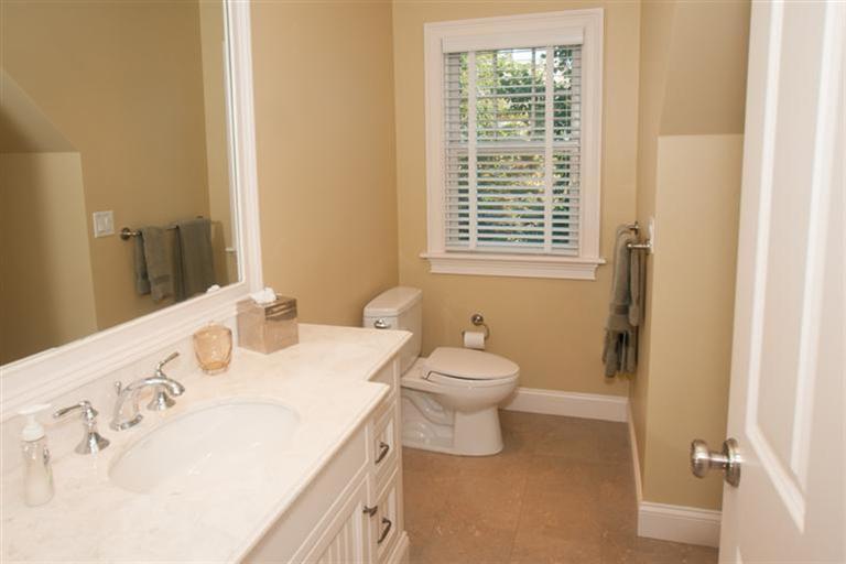 429 Monomoscoy Road Mashpee, MA 02649 - Photo 16 of 26 a bathroom with a sink a toilet and a window