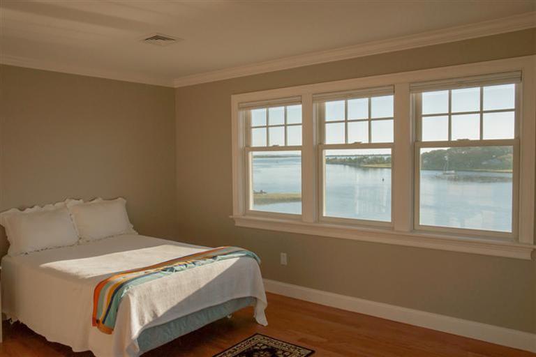429 Monomoscoy Road Mashpee, MA 02649 - Photo 17 of 26 a bedroom with a bed and a window